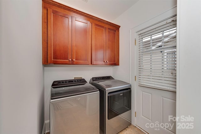 laundry room with cabinet space and independent washer and dryer