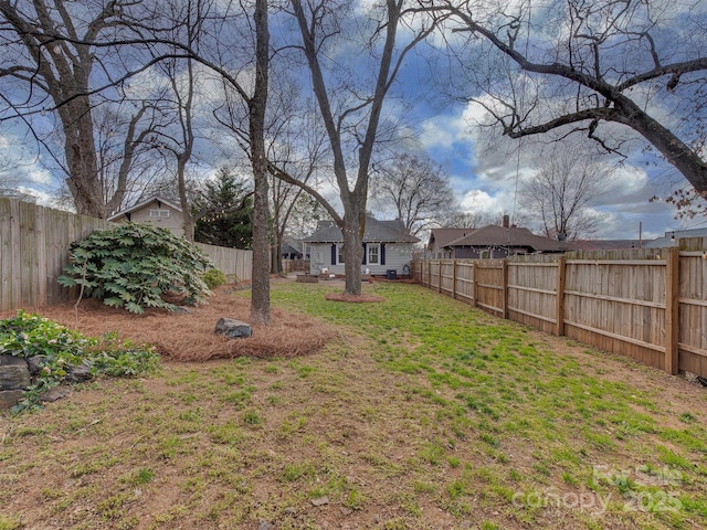 view of yard featuring a fenced backyard