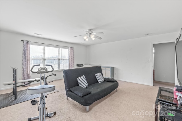 workout room featuring carpet, visible vents, ceiling fan, and baseboards