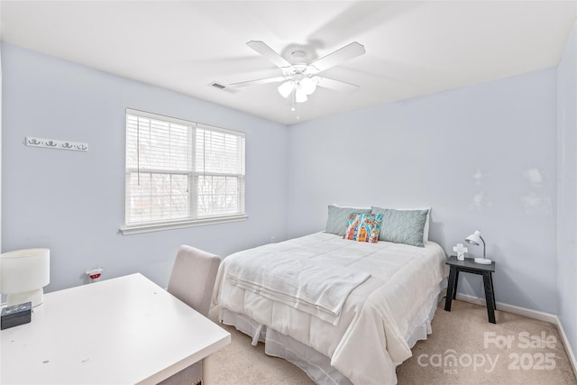 bedroom with light colored carpet, visible vents, ceiling fan, and baseboards