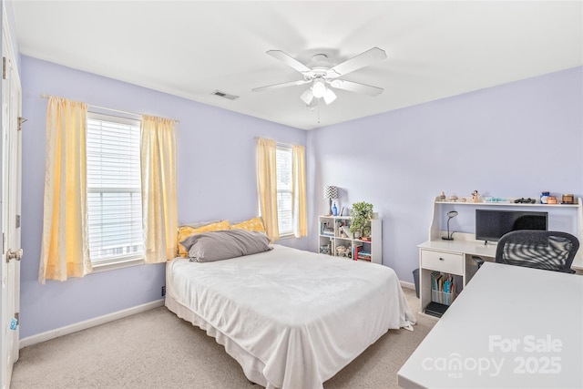 bedroom featuring a ceiling fan, light colored carpet, visible vents, and baseboards