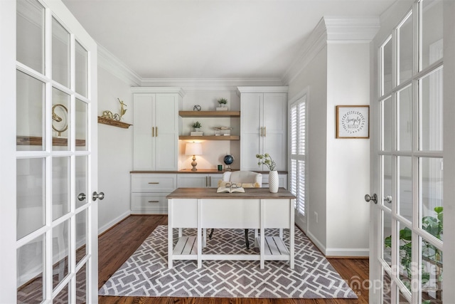 office area with baseboards, dark wood finished floors, crown molding, and french doors