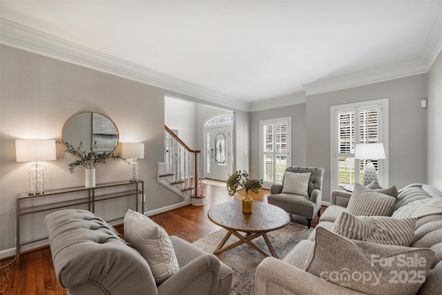 living area with baseboards, stairway, and wood finished floors