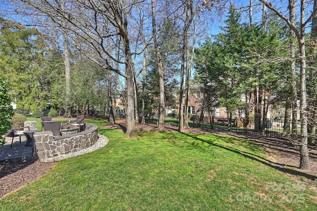 view of yard with fence and a patio