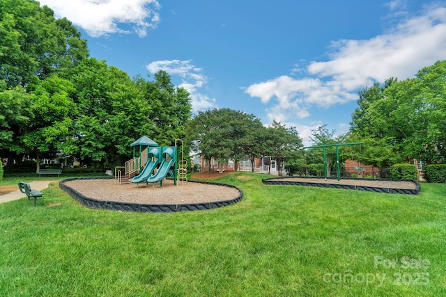 communal playground featuring a yard