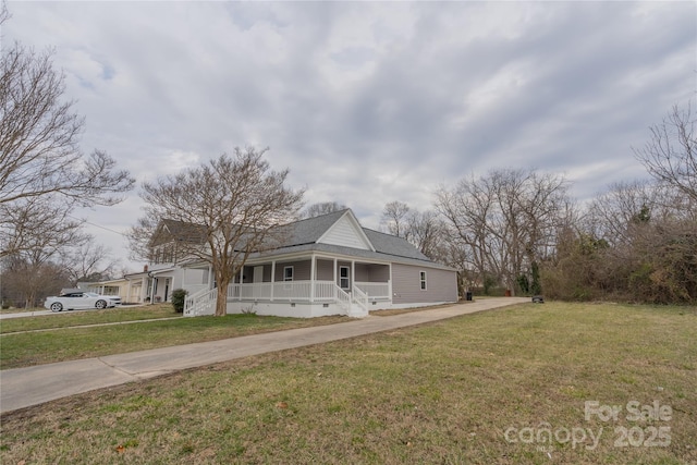 view of front facade with crawl space, covered porch, a front lawn, and concrete driveway