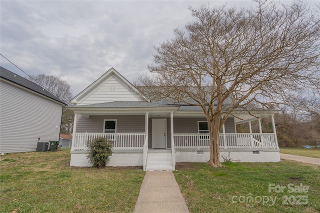 view of front of home featuring a porch, a shingled roof, a front lawn, and central air condition unit