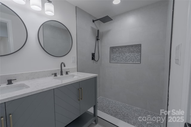 116 11th St, Spencer, NC 28159 - bathroom with double vanity, a tile shower, and recessed lighting