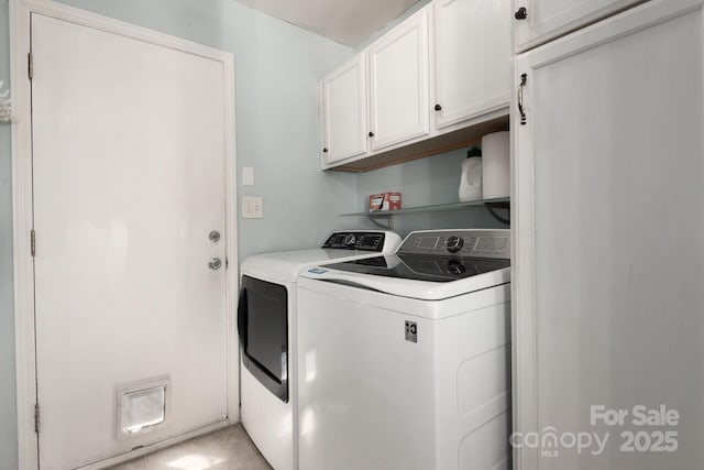 washroom with separate washer and dryer and cabinet space