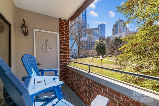 balcony featuring a view of city