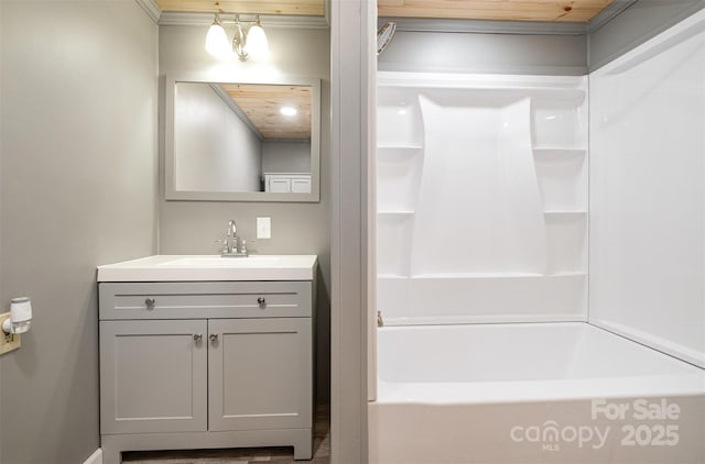 full bath with vanity and a bath