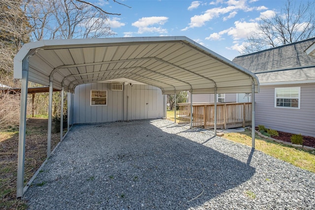 view of parking / parking lot with a detached carport and driveway