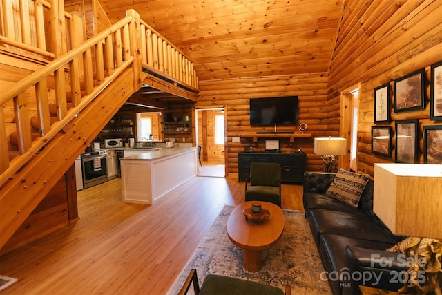 living area featuring high vaulted ceiling, wooden ceiling, light wood-style flooring, and log walls