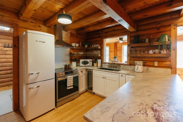 kitchen featuring beverage cooler, white appliances, a sink, wall chimney range hood, and open shelves