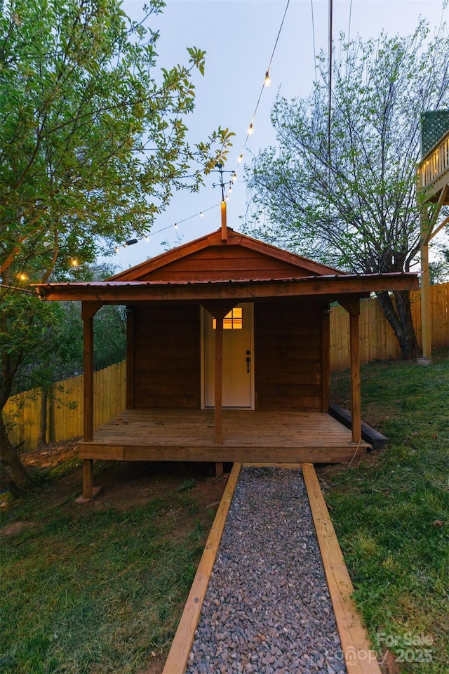 view of outdoor structure featuring fence