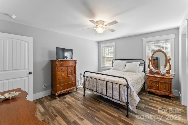 bedroom featuring ceiling fan, baseboards, and wood finished floors