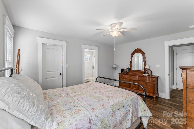 bedroom featuring a ceiling fan, ensuite bath, and wood finished floors