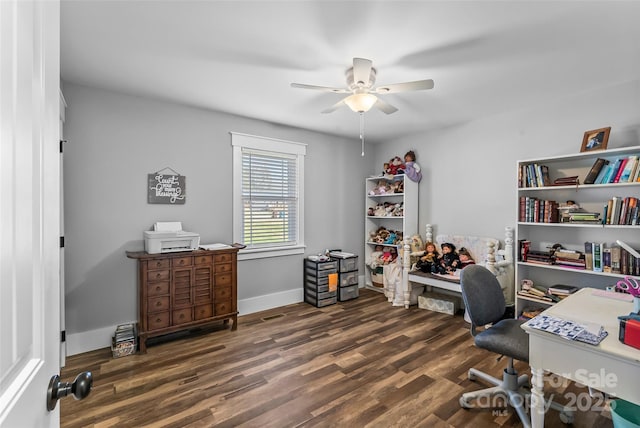 home office featuring baseboards, a ceiling fan, and wood finished floors