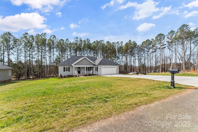 ranch-style home with an attached garage, concrete driveway, covered porch, and a front yard