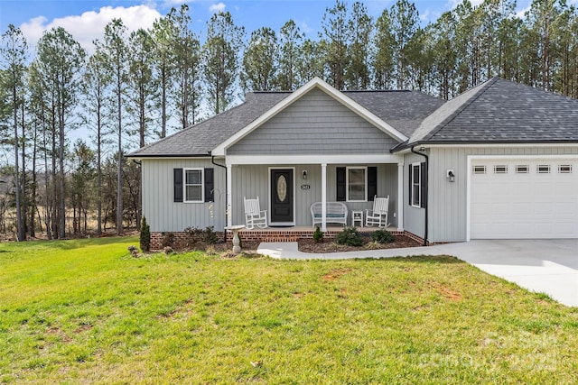 ranch-style home featuring covered porch, roof with shingles, a front yard, and an attached garage