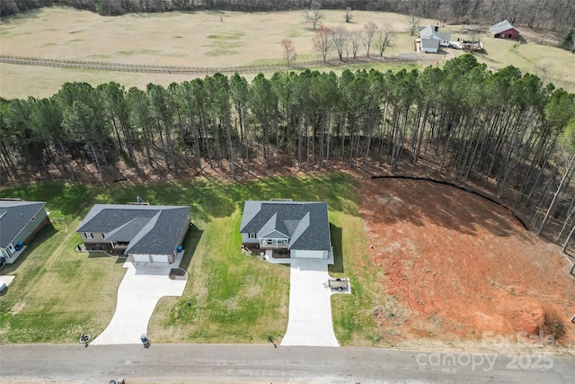 birds eye view of property with a rural view