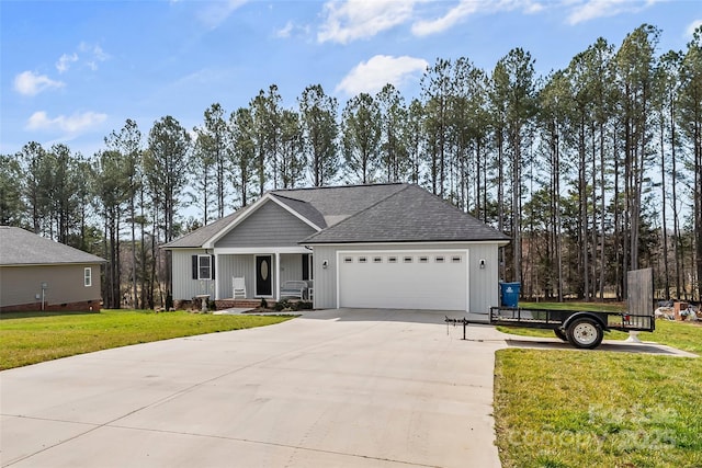 ranch-style house with a shingled roof, concrete driveway, board and batten siding, a garage, and a front lawn