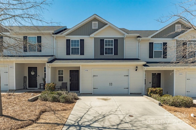 view of property featuring a porch, concrete driveway, board and batten siding, and a garage