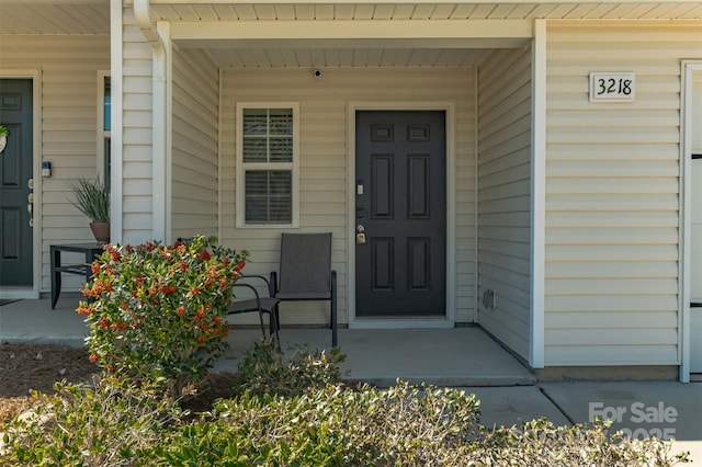 property entrance with a porch