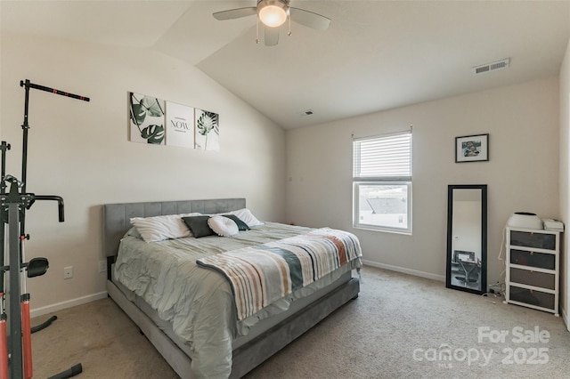 carpeted bedroom with baseboards, visible vents, and vaulted ceiling