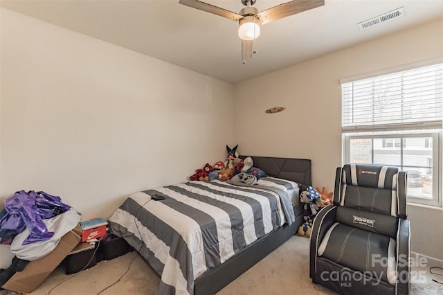 bedroom featuring ceiling fan, visible vents, and carpet flooring