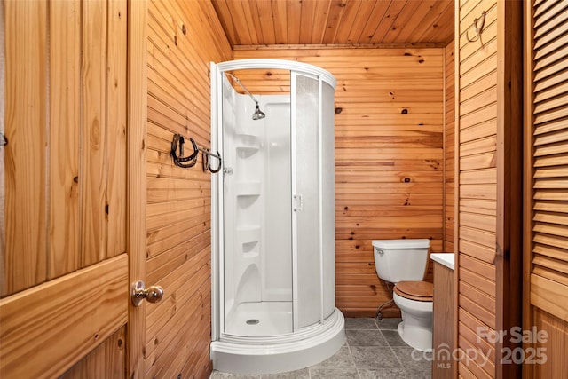 full bath featuring toilet, a closet, wooden ceiling, wood walls, and a shower stall