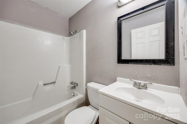 bathroom featuring toilet, shower / bathtub combination, a textured ceiling, and vanity