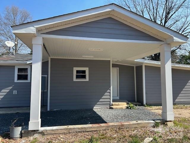 view of front of home featuring a carport