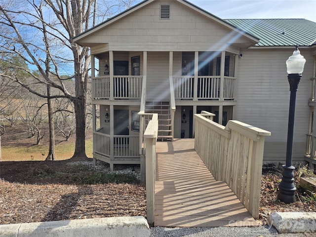 view of front of house featuring covered porch and metal roof