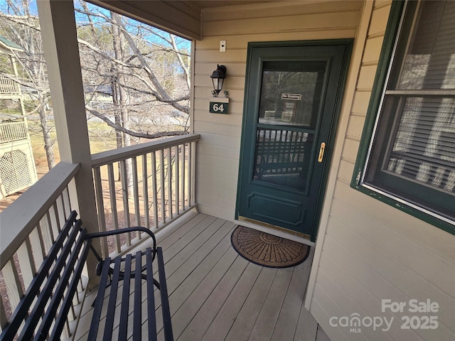 entrance to property featuring a balcony