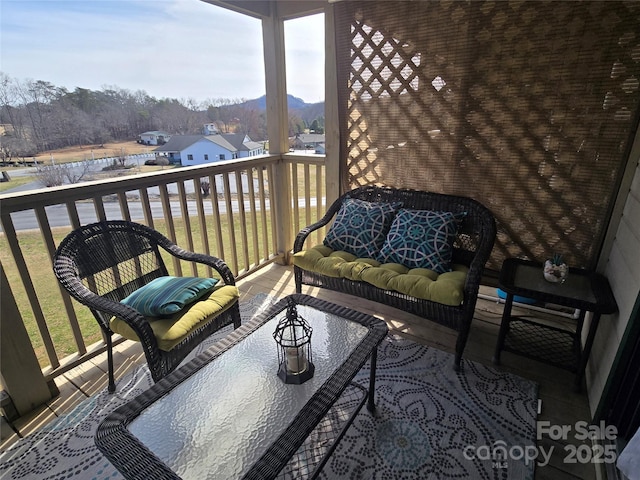 balcony featuring a sunroom