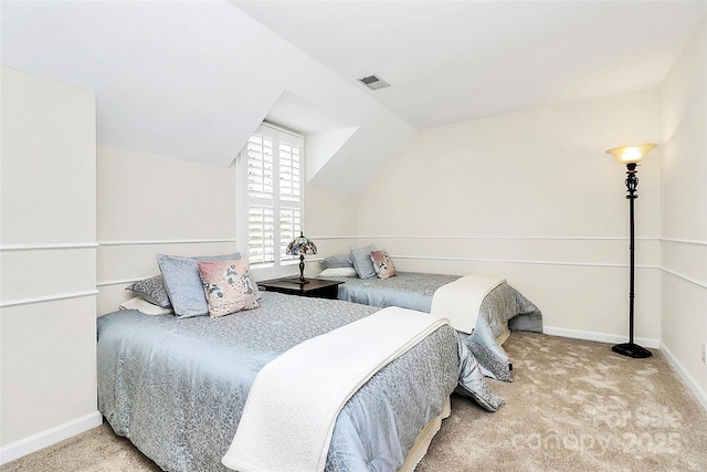 bedroom featuring carpet flooring, baseboards, lofted ceiling, and visible vents