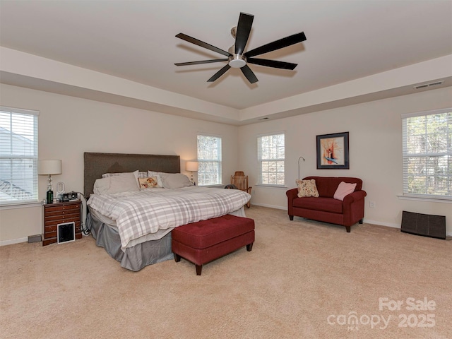 bedroom featuring carpet floors, baseboards, visible vents, and a ceiling fan