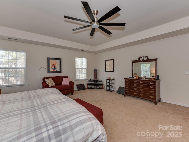 carpeted bedroom with multiple windows and visible vents