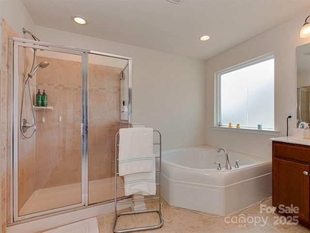 bathroom featuring recessed lighting, vanity, a shower stall, a bath, and radiator