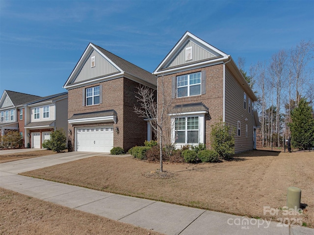 traditional home featuring a garage, brick siding, board and batten siding, and concrete driveway