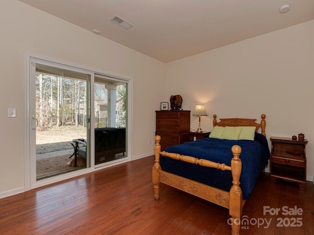 bedroom featuring access to exterior, visible vents, baseboards, and wood finished floors