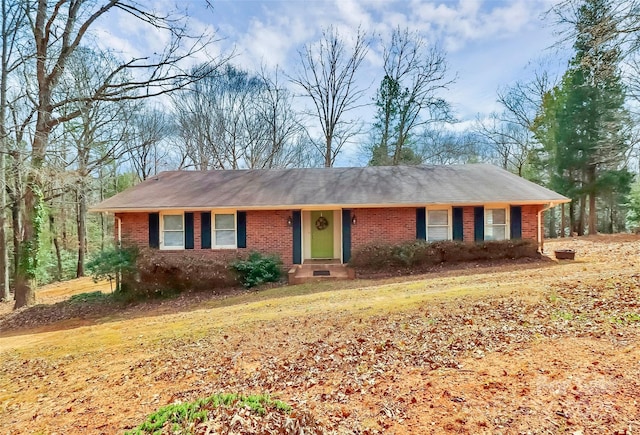 ranch-style home featuring brick siding