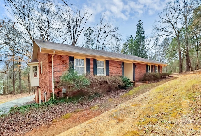 ranch-style house with brick siding