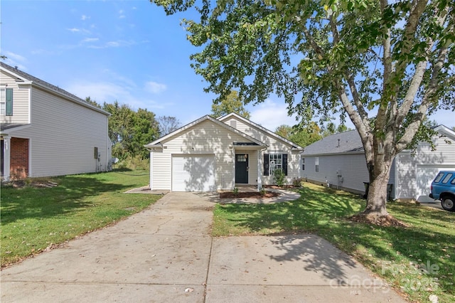 view of front of home with an attached garage, concrete driveway, and a front yard