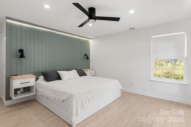 bedroom with recessed lighting and light wood-style flooring