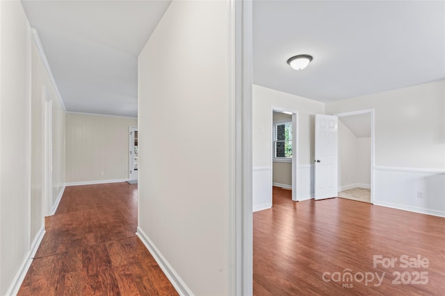 hallway with dark wood finished floors