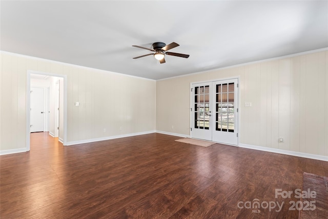 empty room with a ceiling fan, ornamental molding, dark wood-style flooring, and french doors