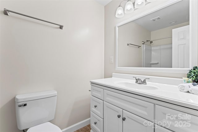 full bathroom featuring baseboards, visible vents, toilet, walk in shower, and vanity