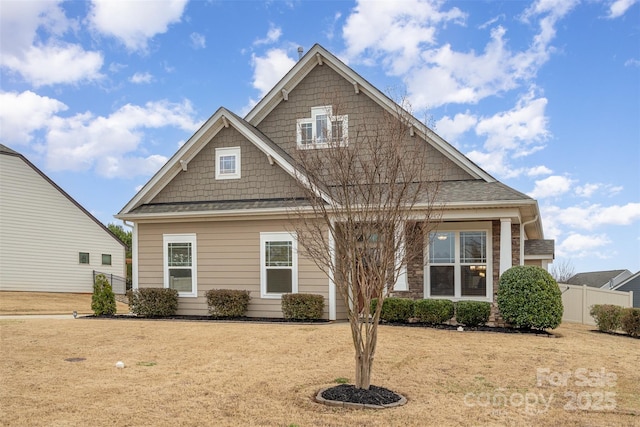 view of front of property featuring fence